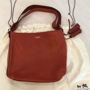 Orange leather hobo bag from Coach